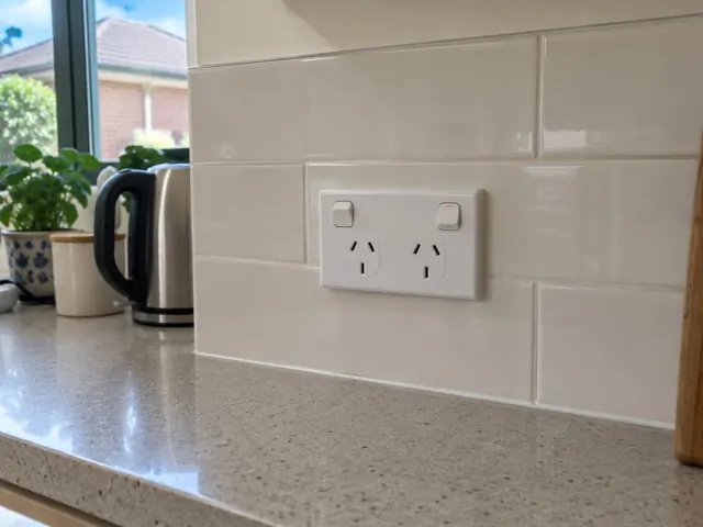 New double power point on a tiled kitchen splashback beside a benchtop in Wallsend